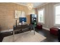 A bright home office featuring wood floors, natural light, neutral colors, modern furnishings and stylish decor at 4280 Castlewood Rd, Cumming, GA 30040
