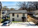 Charming two-story home with a well-manicured lawn and a driveway at 1051 Curran Nw St, Atlanta, GA 30318