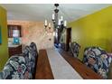 Traditional dining room with decorative walls and large wooden table at 5925 Tortosa Pl, Atlanta, GA 30349