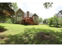 Lush backyard with a wooden deck, perfect for outdoor entertaining and relaxation at 5665 Stewart Woods Dr, Douglasville, GA 30135