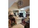 Bright living room with high ceilings, skylights, a fireplace, and elegant furnishings at 999 Ashebrooke Ne Way, Marietta, GA 30068