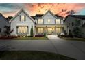 Inviting two-story home with gray siding, dark shutters, and a cozy front porch, perfect for relaxing evenings at 107 Owens Mill Place, Canton, GA 30115
