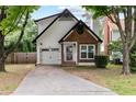 Attractive home featuring a single-car garage, landscaped yard, and inviting front entrance at 969 Oak Sw St, Atlanta, GA 30310