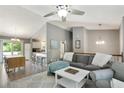 Spacious living room with a high ceiling, hardwood floors, an adjacent kitchen, and sliding glass doors at 1501 Jamerson Landing, Marietta, GA 30066