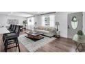 Bright and inviting living room featuring a stylish sofa, modern coffee table, and plenty of natural light at 30 Dewey Se Ln, Marietta, GA 30060