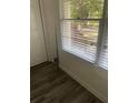 Comfortable bedroom corner featuring natural light through window and ample storage at 735 Brookwood Dr, Forest Park, GA 30297