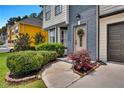 Well-maintained front yard showcasing lush landscaping and inviting entryway at 1075 Litchfield Sw Way, Marietta, GA 30060