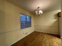 Bright dining room with a chandelier, chair rail detail, and hardwood flooring at 1038 Westfield Se Trce, Smyrna, GA 30082