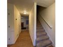 Inviting hallway featuring hardwood floors, stairs, and views into the adjacent living area at 1038 Westfield Se Trce, Smyrna, GA 30082