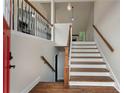 Elegant entryway with hardwood floors, staircase, and an open view to the upper level at 136 Walkers Pond Dr, Villa Rica, GA 30180