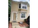 Two-story townhome showcasing a front door entrance and eye-catching window that enhances curb appeal at 5047 Chupp Way Cir, Lithonia, GA 30038