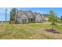Beautiful two-story home with light blue siding, manicured lawn and shrubbery at 101 Ruby Lane, Mcdonough, GA 30252