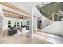 Spacious living room with wood beams, hardwood floors, and modern furnishings at 1358 Peppergrass Nw Trl, Acworth, GA 30101