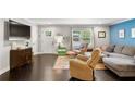 Inviting living room with hardwood floors, modern decor, and comfortable seating area at 984 Ridgecrest Se Dr, Smyrna, GA 30080
