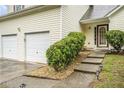 Inviting front entrance with steps leading to the front door, flanked by lush greenery at 436 Berkshire Pl, Fairburn, GA 30213