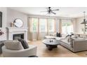 Inviting living area featuring a fireplace, plush seating, and large windows providing natural light at 2167 Crestridge Ne Trl, Atlanta, GA 30329