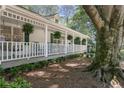 Cozy front porch with green shutters, plants, and rocking chairs for relaxing at 2515 Ridgewood Nw Rd, Atlanta, GA 30318