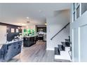 Bright, open-concept living area flows into a kitchen with stainless appliances and staircase to the second level at 2932 Valley Ridge Dr, Decatur, GA 30032