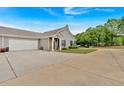 Spacious home with a long driveway leading to an attached two-car garage at 1078 Camry Cir, Dallas, GA 30157