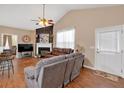 Cozy living room with hardwood floors, fireplace, and comfortable seating arrangement at 1078 Camry Cir, Dallas, GA 30157