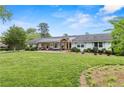 Beautiful one-story home featuring a covered porch and well-maintained lawn at 3967 Manson Se Ave, Smyrna, GA 30082