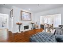 Charming living room features a fireplace and plush sofa, ideal for relaxation and entertaining at 2865 Lenox Ne Rd # 211, Atlanta, GA 30324