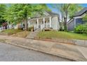 Lovely bungalow featuring a welcoming front porch and manicured lawn at 902 Allene Sw Ave, Atlanta, GA 30310