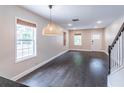 Bright and airy living room with hardwood floors, recessed lighting, and a cozy pendant light at 1555 New Ne St, Atlanta, GA 30307