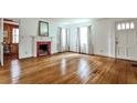 Spacious living room with hardwood floors, fireplace, and a bright, welcoming atmosphere at 1798 Melrose Sw Dr, Atlanta, GA 30310