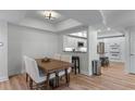 Dining room with a table and view to the kitchen with white cabinets and stainless steel appliances at 3636 Habersham Nw Rd # 2101, Atlanta, GA 30305