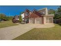 Beautiful home featuring a spacious driveway and an attached two-car garage at 103 Harvest Rdg, Acworth, GA 30102