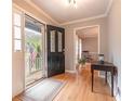Inviting foyer with hardwood floors and a view of the front porch through a beautifully crafted glass door at 130 Brandon Mill Cir, Fayetteville, GA 30214