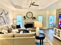 Bright living room featuring a fireplace, modern furniture, and ample natural light at 805 Doe Hill Ln, Roswell, GA 30075