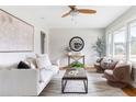 Bright living room with hardwood floors, stylish furnishings, and lots of natural light at 118 Wheelan School Rd, Dallas, GA 30157