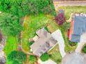 Aerial view of a home with a spacious backyard, mature trees, and well-maintained landscaping at 2726 Riderwood Ne Ln, Marietta, GA 30062