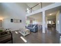 Spacious, light-filled living room with soaring ceilings, hardwood floors, and an open floor plan at 3985 Starwood Dr, Cumming, GA 30028