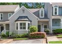 Charming townhome with well-maintained landscaping and inviting curb appeal at 404 Carryback Dr, Marietta, GA 30068