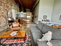 Stylish loft features exposed brick, combined living and sleeping areas, and a modern kitchen at 170 Boulevard Se # H301, Atlanta, GA 30312