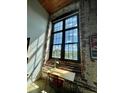 Cozy office nook with exposed brick and large window, perfect for work or study at 170 Boulevard Se # H301, Atlanta, GA 30312