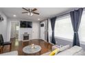 Stylish living room with hardwood floors, ample natural light, and a decorative fireplace at 2462 Pate S St, Snellville, GA 30078