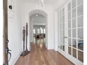 Elegant foyer with hardwood floors, stylish lighting, and a view into the open-concept living spaces at 4505 Caroline Walk, Dunwoody, GA 30338