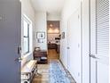 Inviting entryway with a bench and view of the kitchen at 112 Rogers St # 208, Atlanta, GA 30317