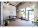 Stylish lobby area with modern lighting, table and chairs, and a large window at 112 Rogers St # 208, Atlanta, GA 30317