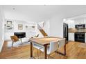 Bright living room features hardwood floors, a fireplace with built-in shelving, and an open floor plan at 11 Ardmore Nw Sq, Atlanta, GA 30309