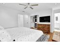Bright main bedroom with wood floors, walk-in closet, and dresser at 11 Ardmore Nw Sq, Atlanta, GA 30309