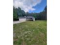 Inviting home with an attached two car garage and front deck at 129 Carolyn Path, Rockmart, GA 30153