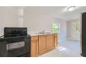 Functional kitchen showcasing ample cabinet space and essential appliances for a home chef at 971 Sims Nw Ave, Atlanta, GA 30318