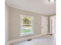 Bright living room featuring clean floors, large windows, and freshly painted walls at 971 Sims Nw Ave, Atlanta, GA 30318