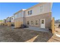 Exterior view of a townhome with a small yard and patio space surrounded by a new wooden fence at 4667 Larkfield Way, Powder Springs, GA 30127