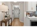 Inviting foyer features wood floors and flows seamlessly into the kitchen and living areas at 4667 Larkfield Way, Powder Springs, GA 30127